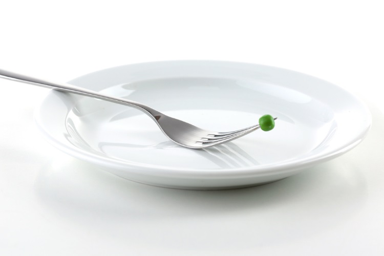An empty plate with a single pea on a fork.